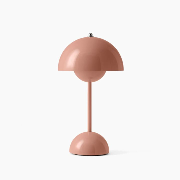 Pink table lamp with a white background