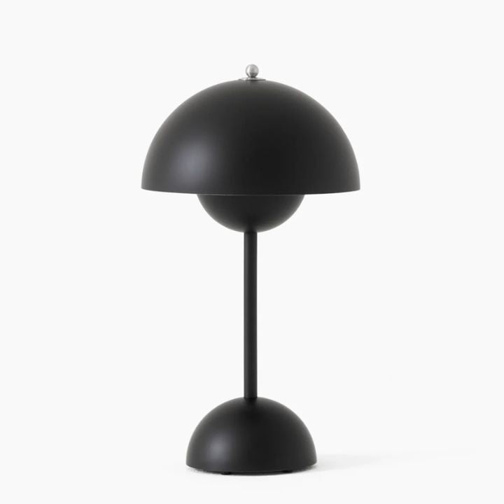 Black table lamp with a unique design on a white background