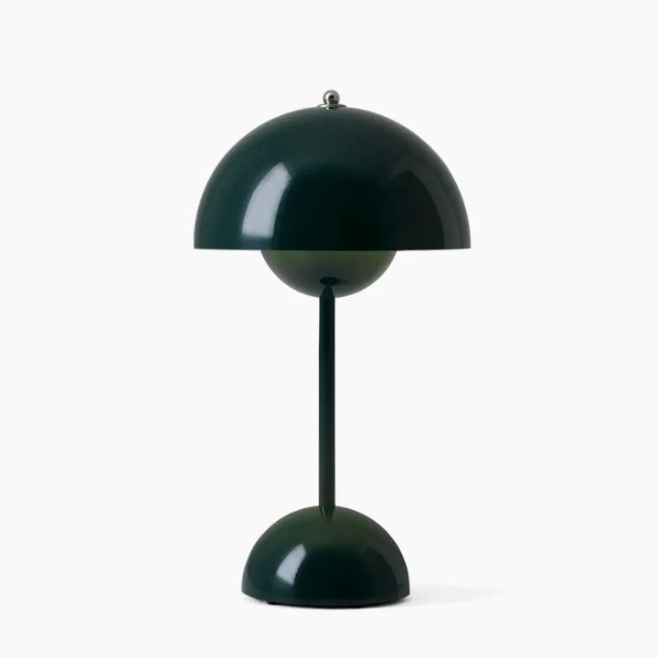 Green table lamp with a unique design on a white background