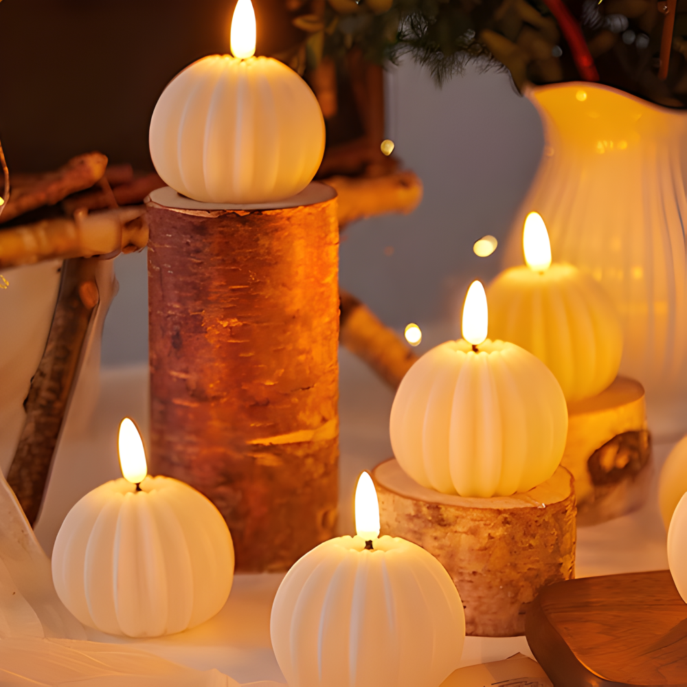 White pumpkin-shaped candles on wooden stands with a warm glow.