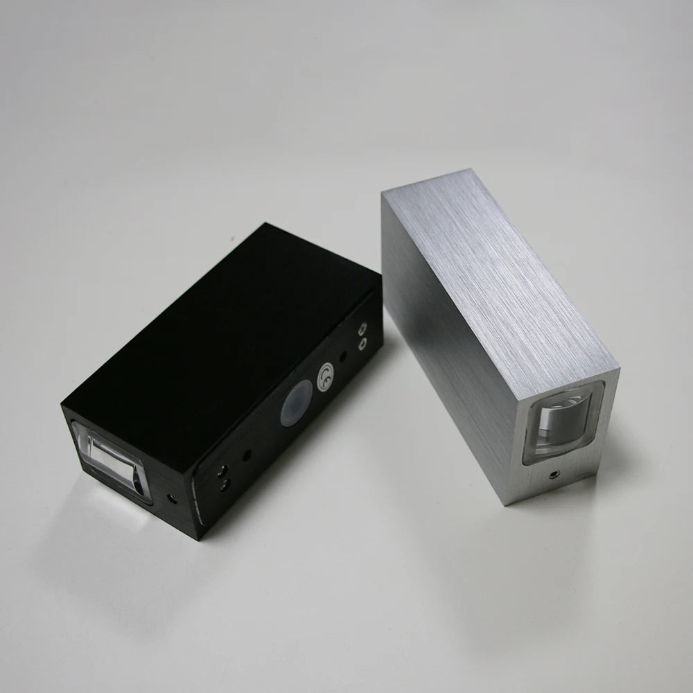 Black and silver electronic devices on a gray background