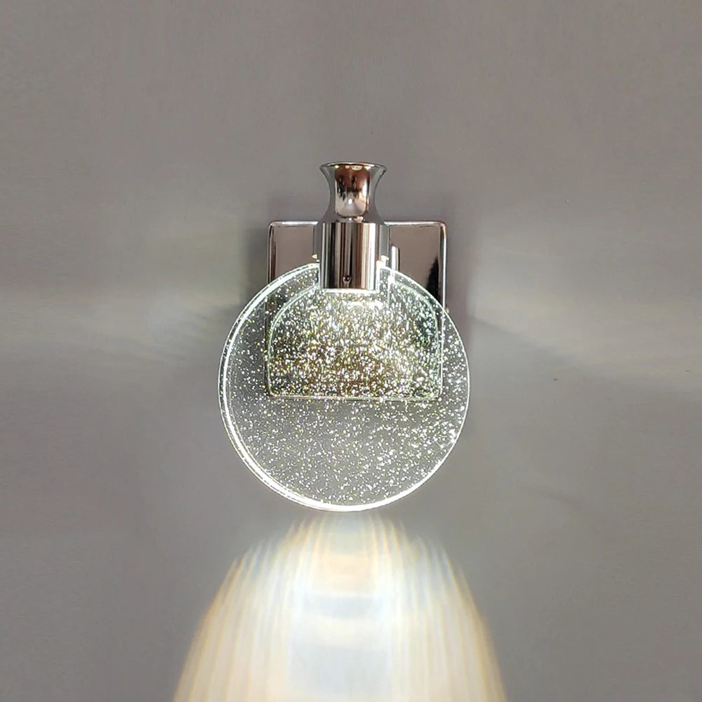 Decorative wall light fixture with a glass cover on a gray background