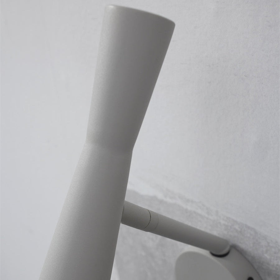 White cylindrical object on a light gray background