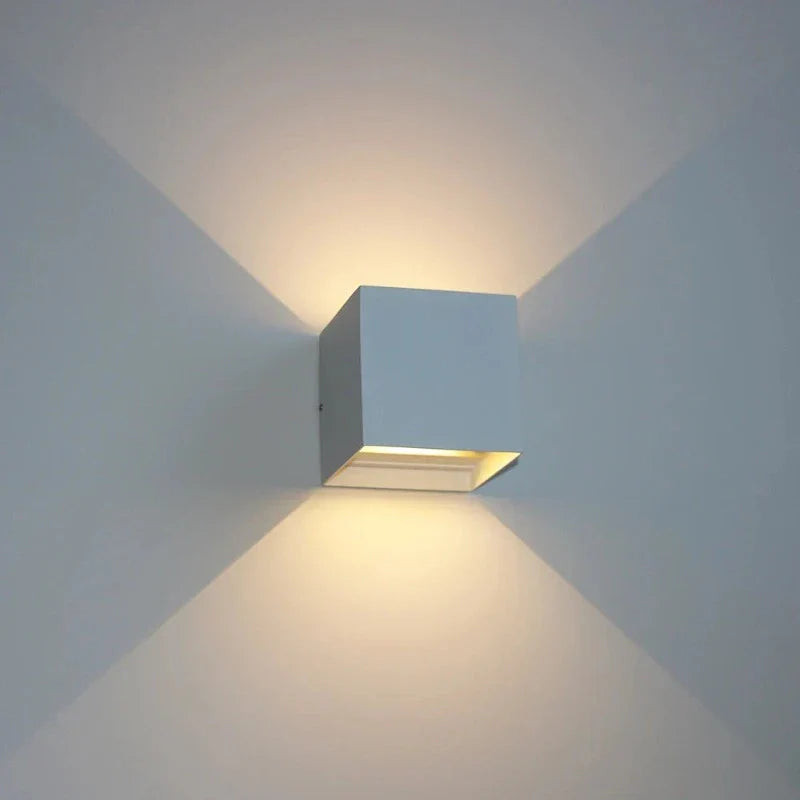Modern square wall light fixture on a plain wall