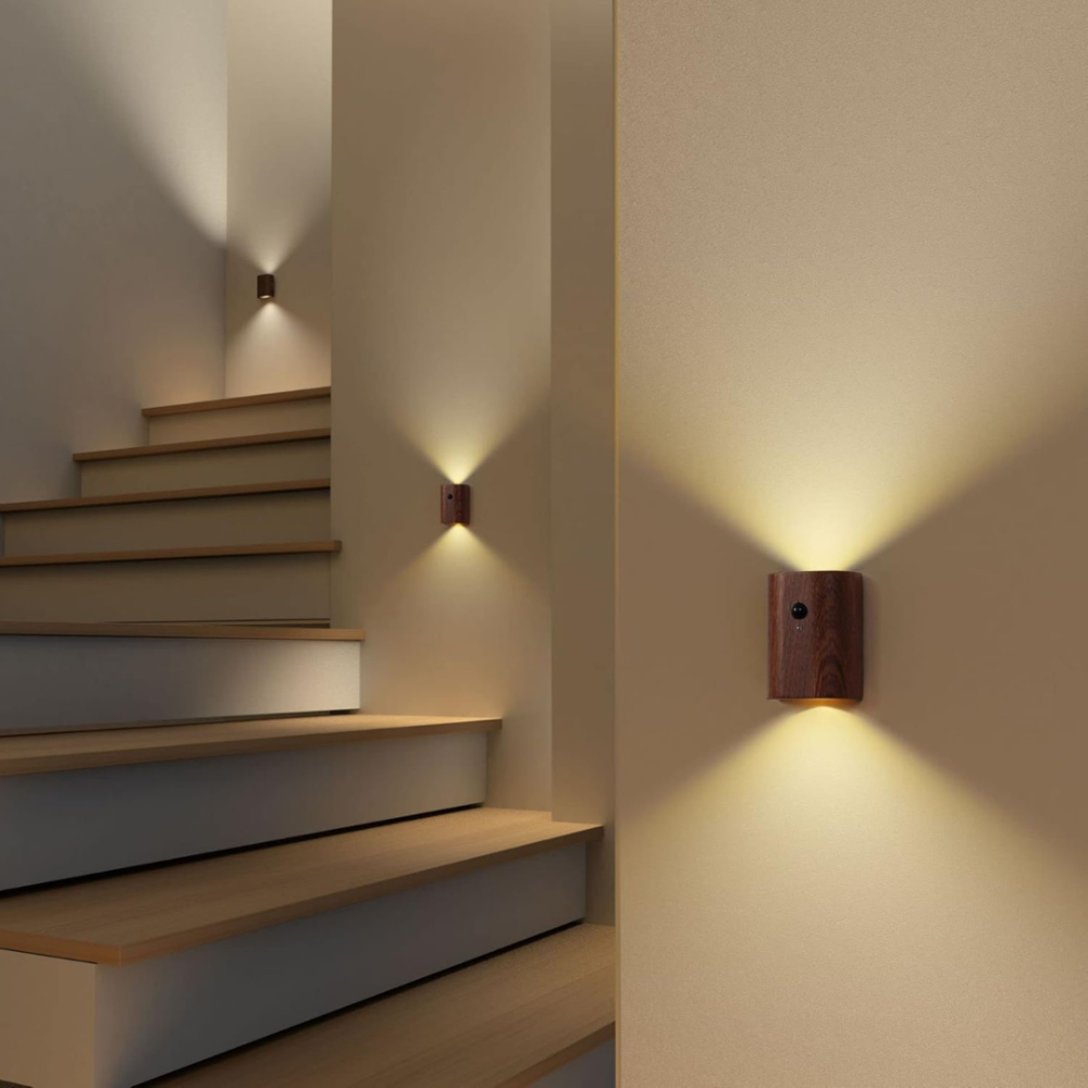 Wall-mounted lights illuminating a staircase in a home setting