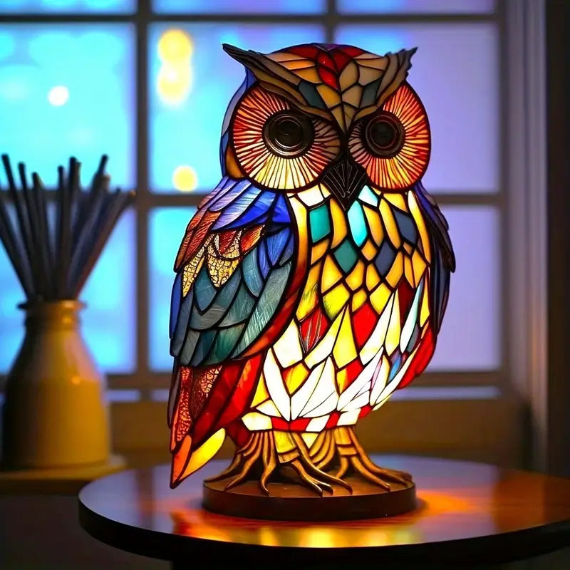 Colorful owl-shaped lamp on a table with a blurred background