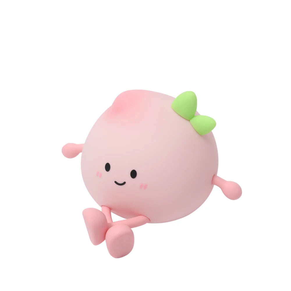 Plush toy with a cute face and green bow on a white background