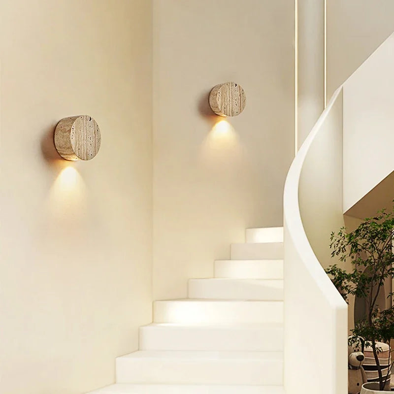 Modern wall lights on a staircase with a neutral color scheme