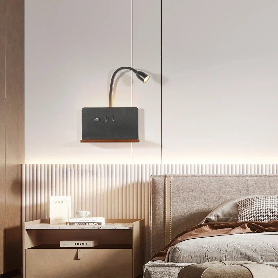 Modern bedroom with nightstand, lamp, and bed.