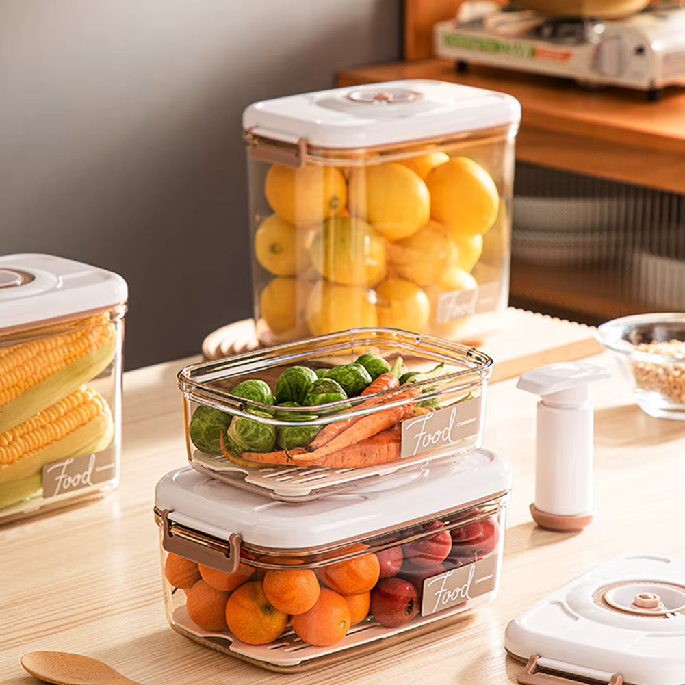 Set of food storage containers with fruits and vegetables on a kitchen counter.