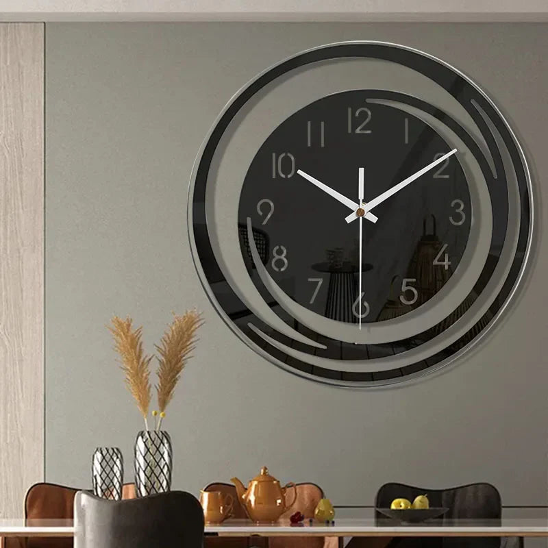 Modern wall clock on a gray wall with a dining area below