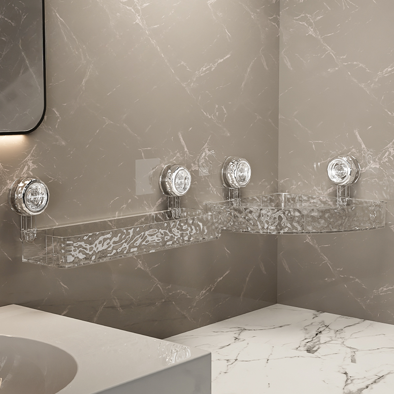 Bathroom with marble walls and a shelf with decorative items.