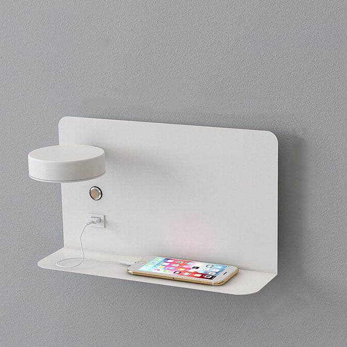 White wall-mounted charging station with a smartphone on a gray background