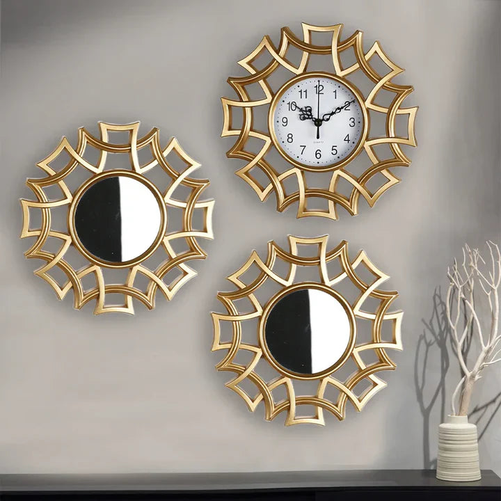Three decorative wall mirrors with clock on a plain background