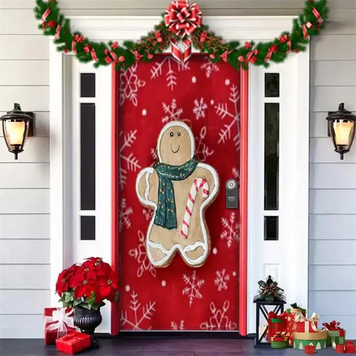Decorative Christmas door with gingerbread man design, red background, and festive decorations.