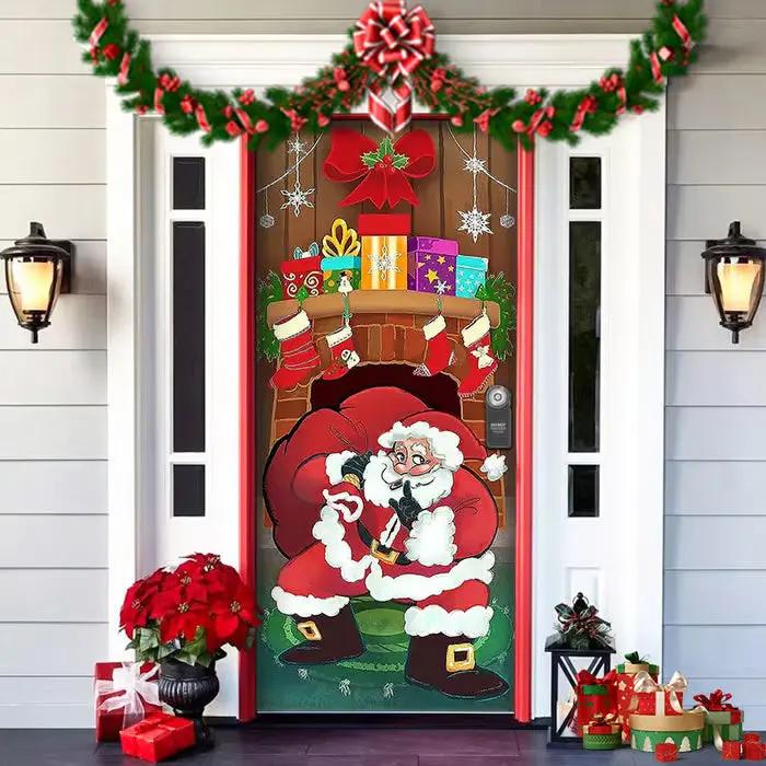 Decorative door with Santa Claus and Christmas decorations on a house exterior.