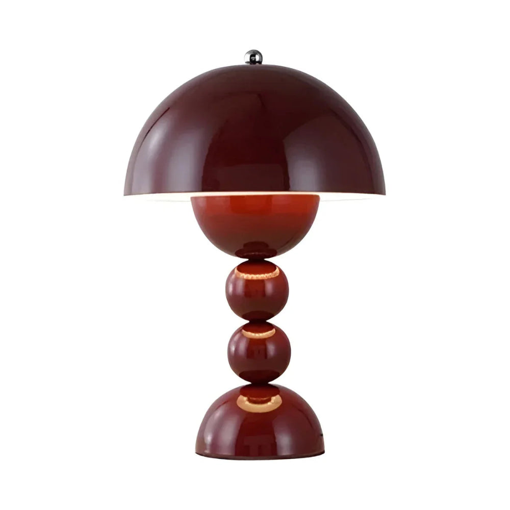 Red table lamp with a unique design on a white background