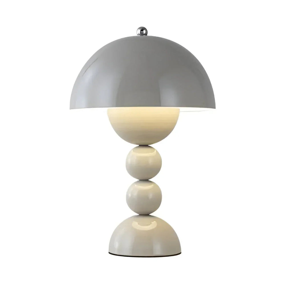 Modern table lamp with a gray dome shade and white cylindrical base on a white background