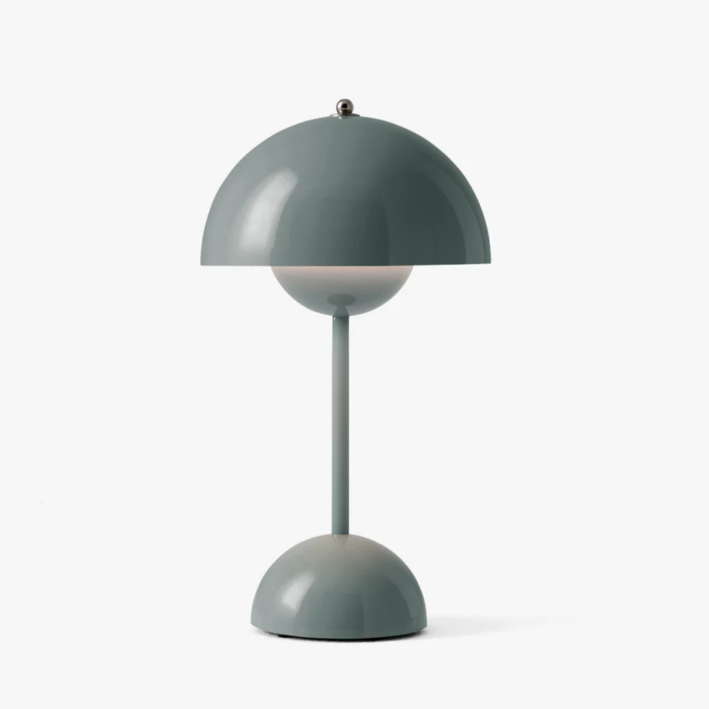 Green table lamp with a modern design on a white background