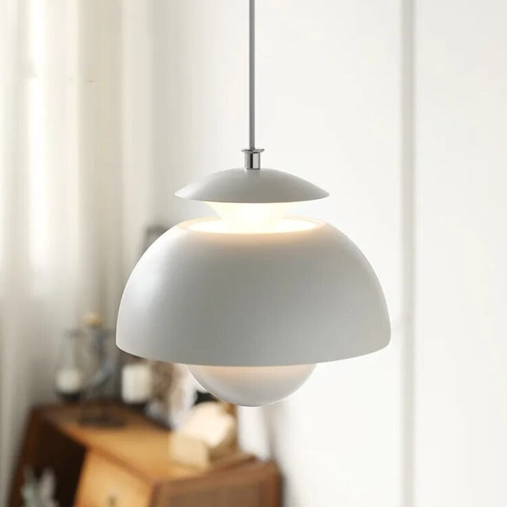 Gray pendant light hanging in a room with a blurred background
