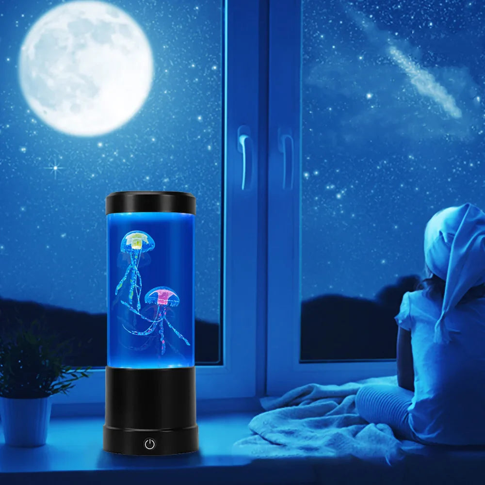 Laser cutout of a jellyfish in a cylindrical light show device with a person sitting by a window at night.