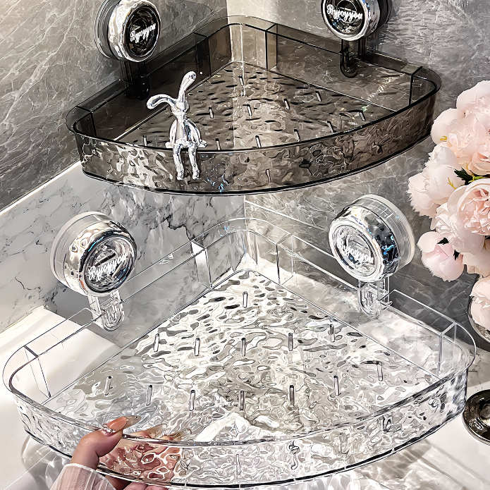 Clear acrylic corner shelf with decorative items on a bathroom counter