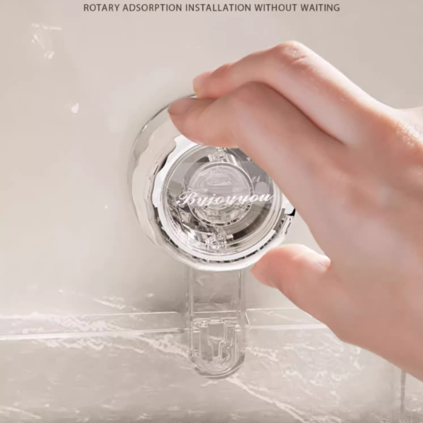 Hand holding a transparent device with 'Biyeyou' branding on a marble surface.