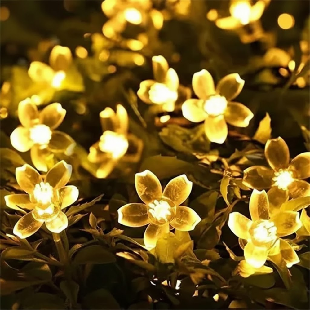 String of flower-shaped lights on a dark background