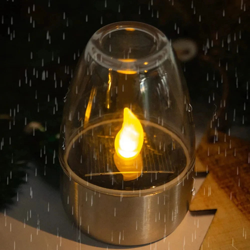 Candle in a glass lantern on a rainy day