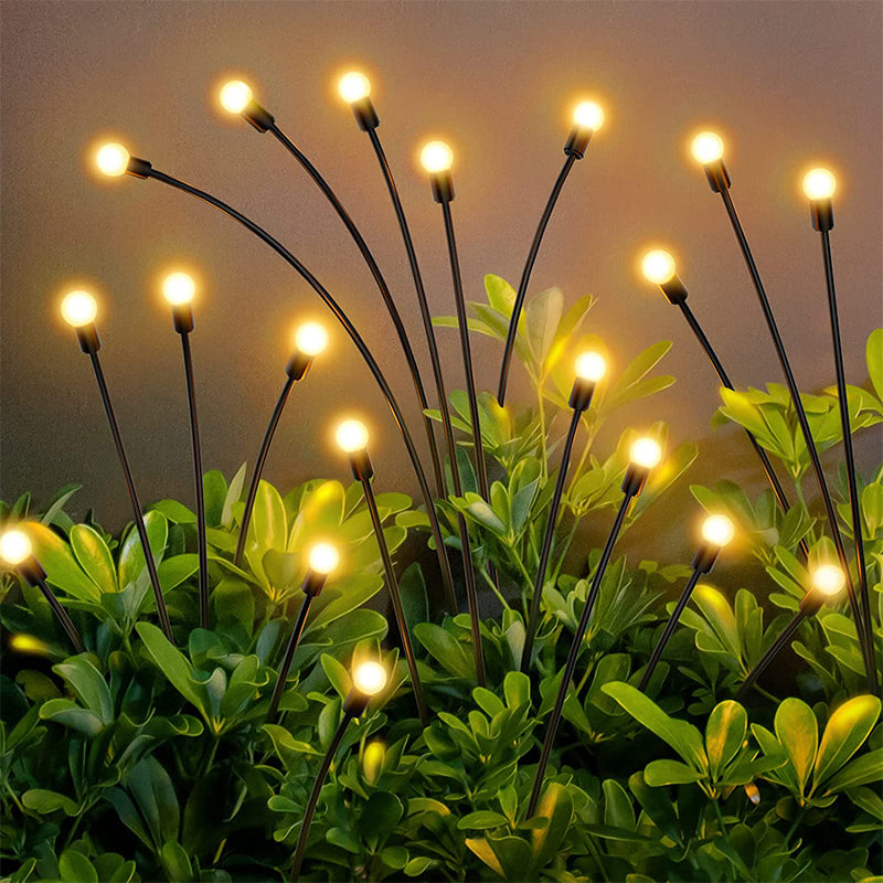 Solar-powered garden lights with glowing bulbs on a plant background
