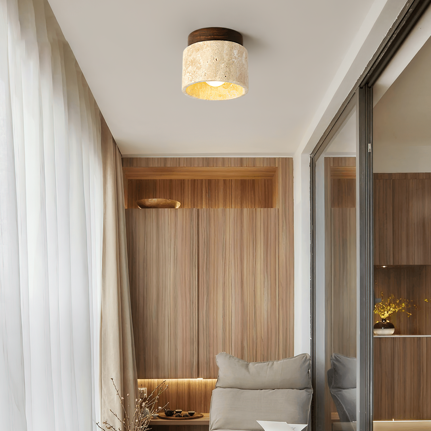 Modern interior design of a room with neutral tones, light wood, and soft lighting.