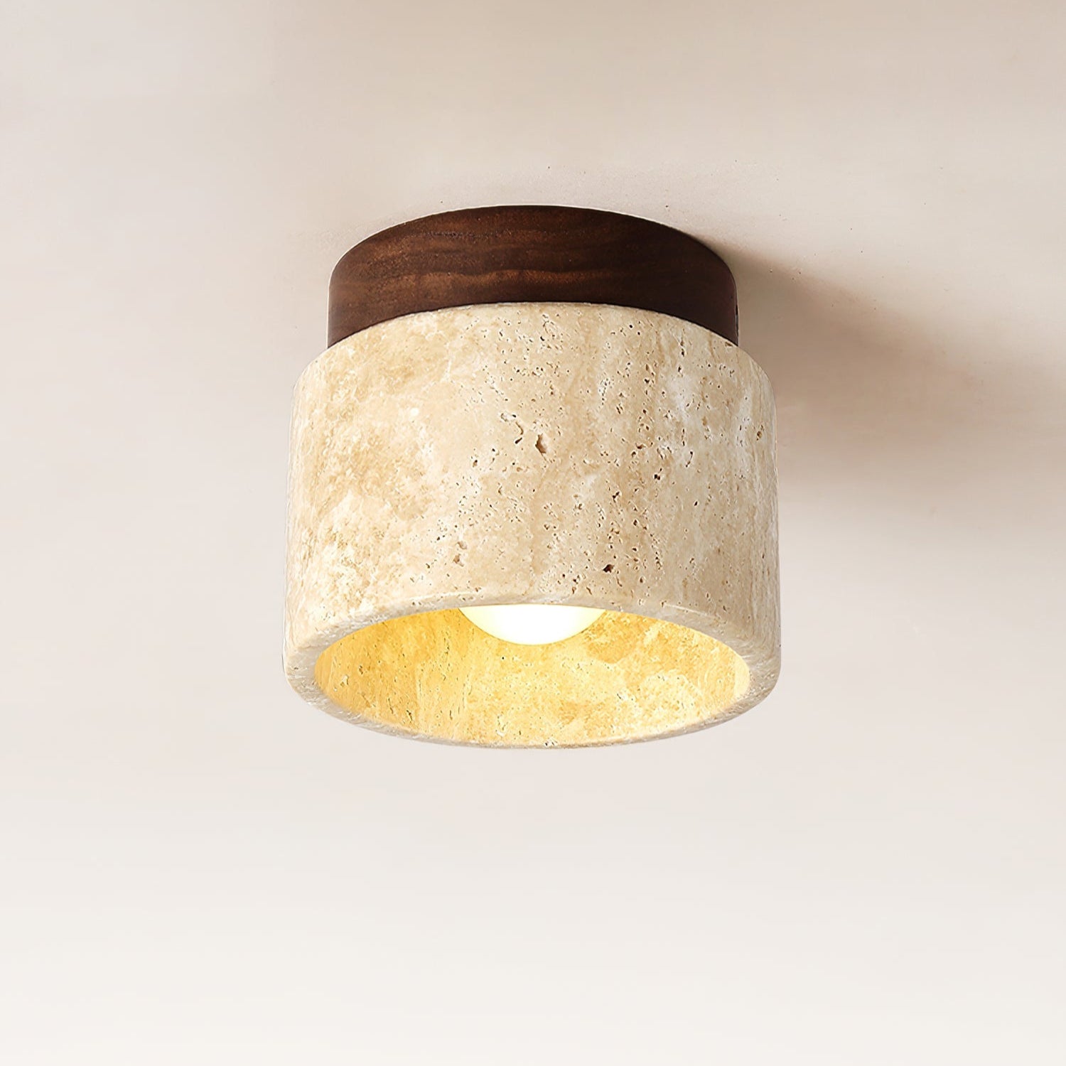 Ceiling light fixture with wooden top and beige stone base on a neutral background