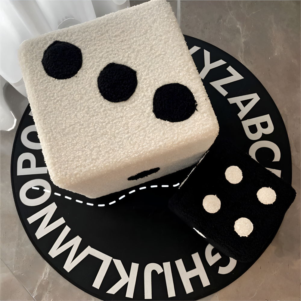 Toy dice with black dots on a circular alphabet mat