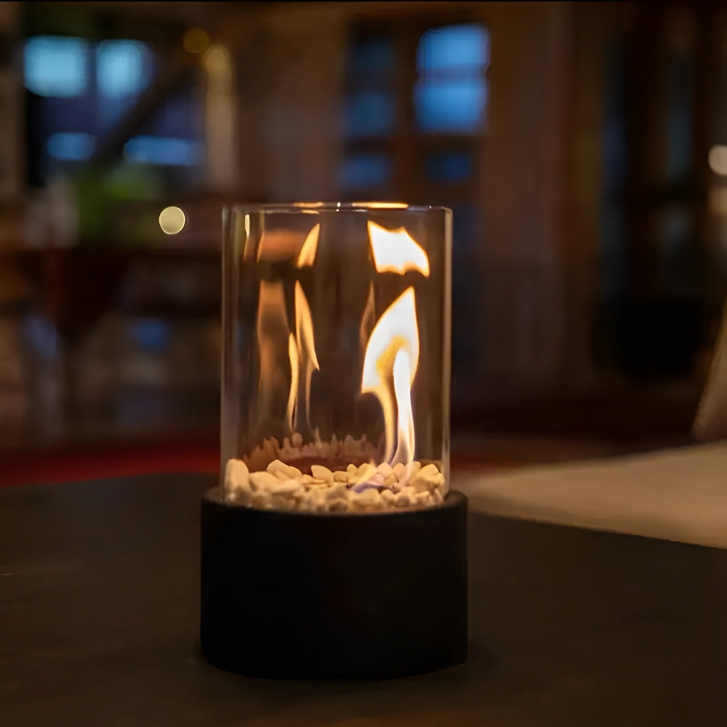Glass container with flames on a blurred background