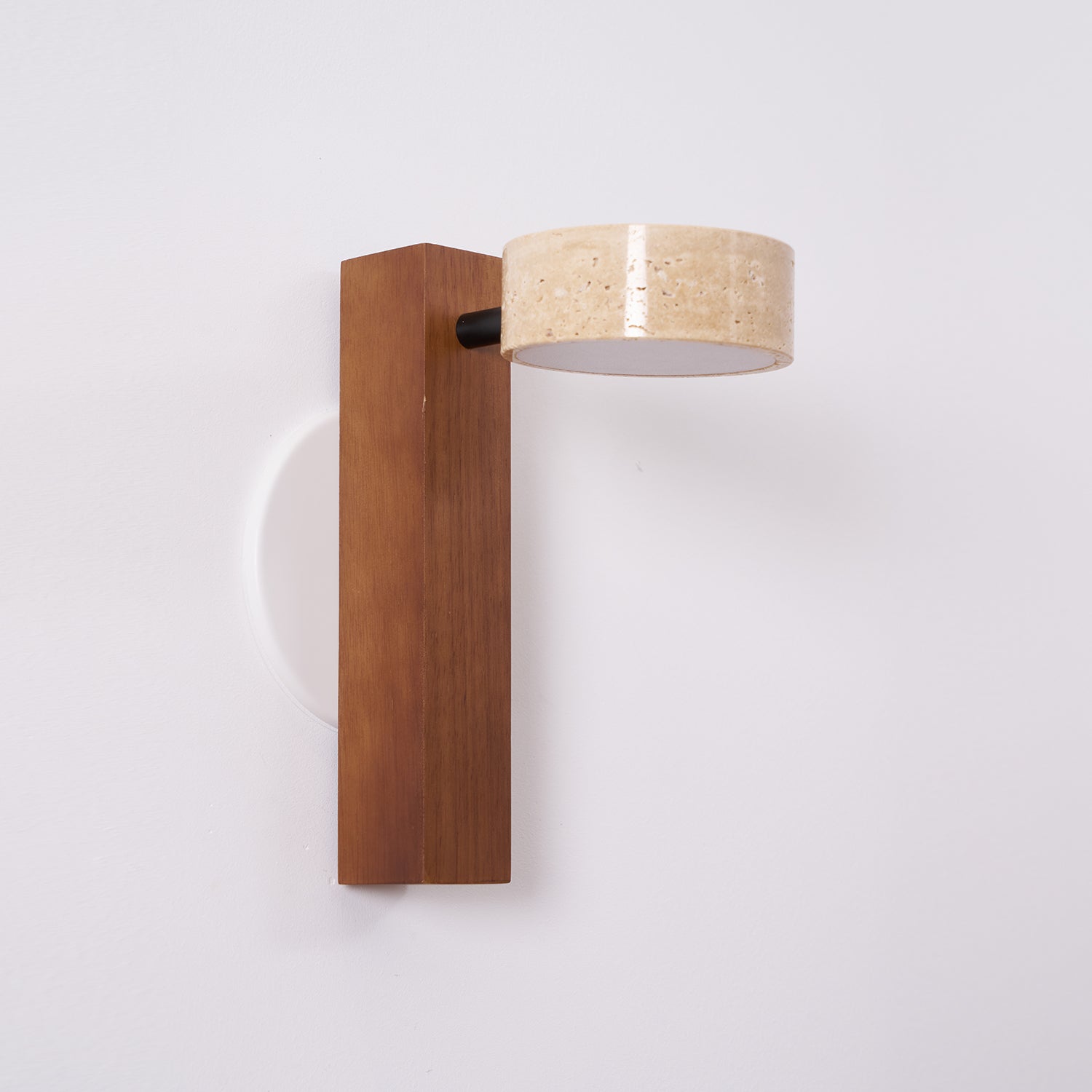 Wall-mounted light fixture with wooden base and beige lampshade on a white background