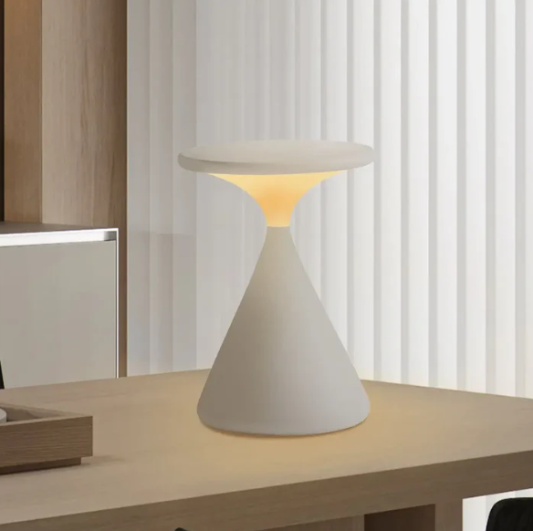 Modern table lamp with a geometric design on a wooden surface.