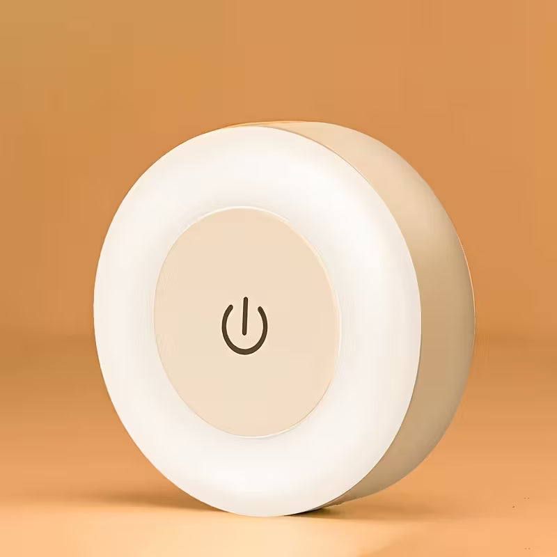 Round night light with power symbol on a beige background