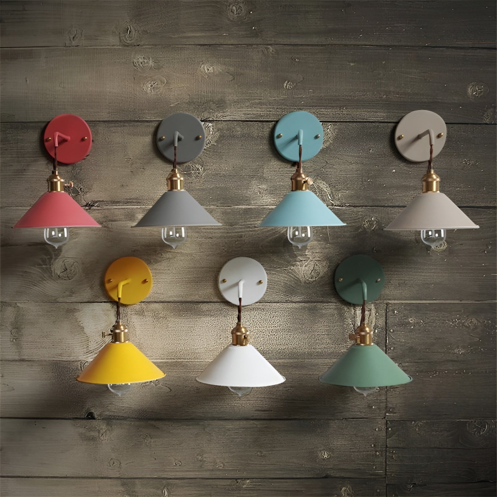 Set of colorful wall sconces against a wooden wall.