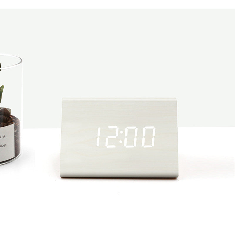 Digital clock displaying the time '12:00' on a white background