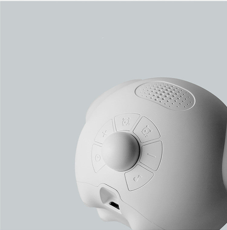 White electronic device with control buttons on a light gray background