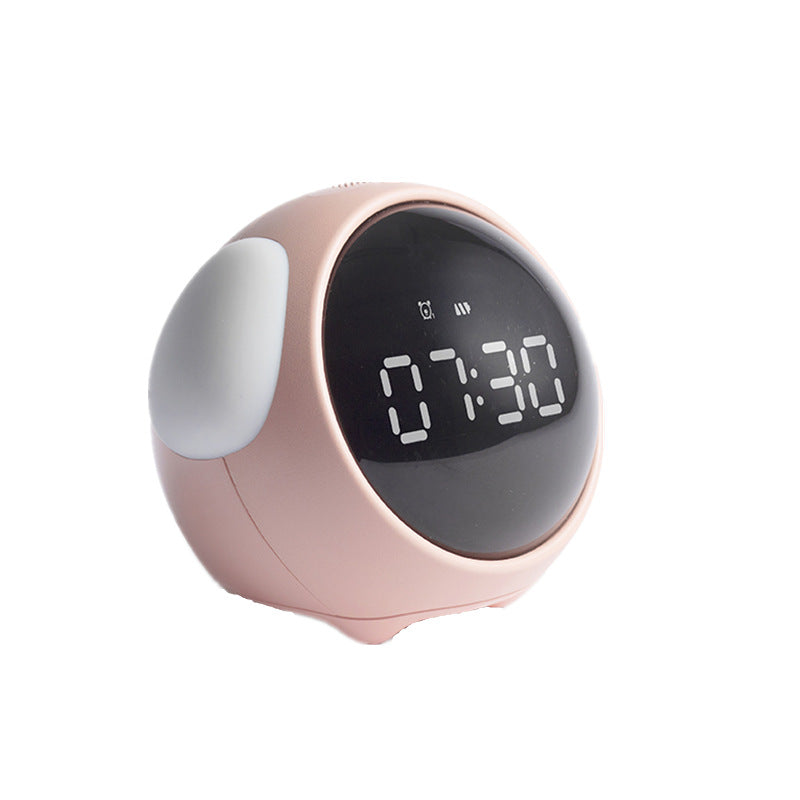Digital clock with a pink casing on a white background