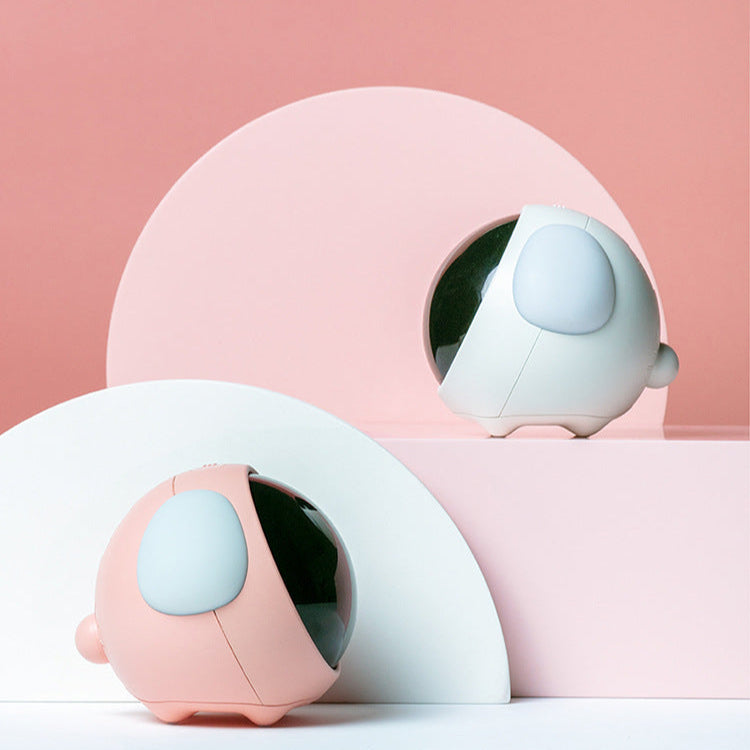 Two round, pink and white objects with a light blue circular feature on a pink background