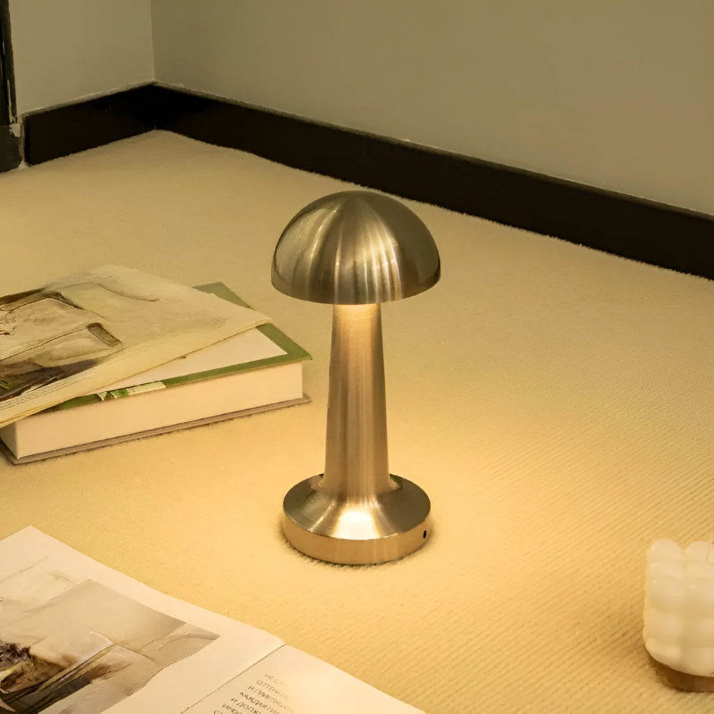 Mushroom-shaped desk lamp on a desk with books and papers.