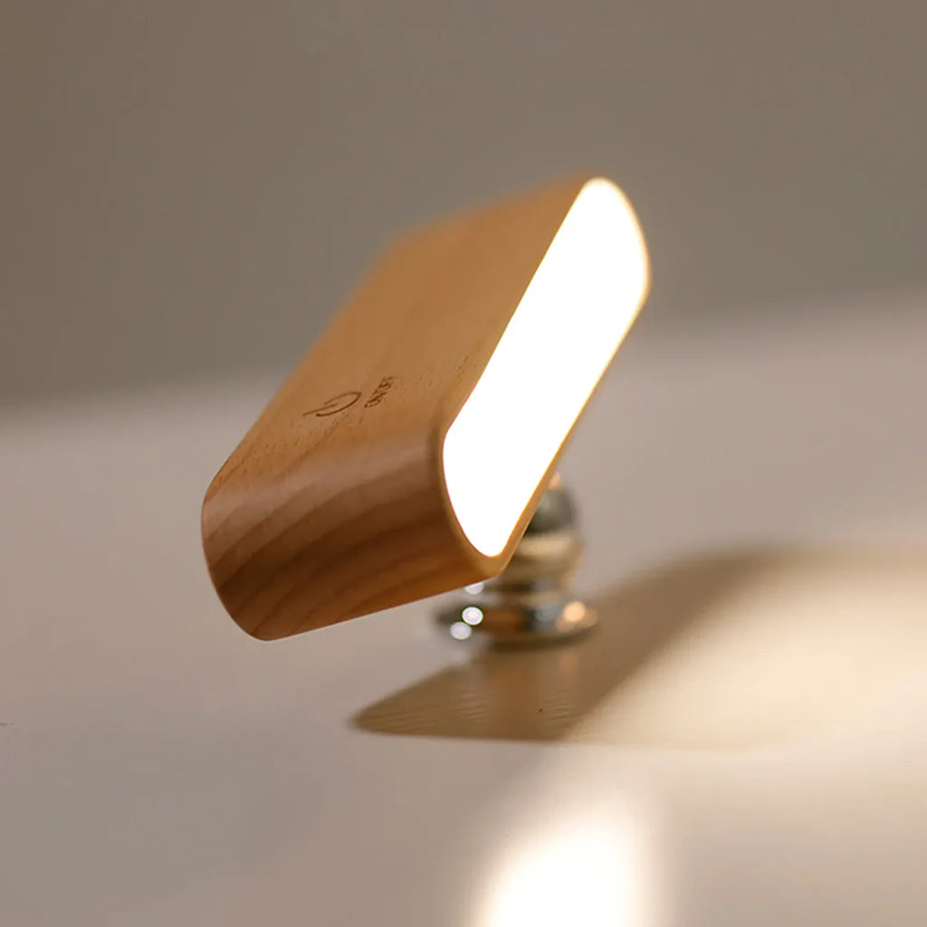 Wooden lamp with a warm glow on a neutral background