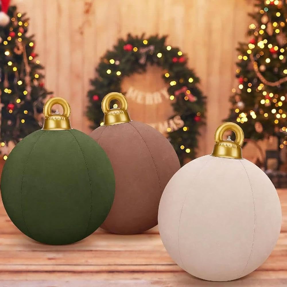 Three Christmas ornaments in green, brown, and white with gold hangers on a wooden surface with festive background.