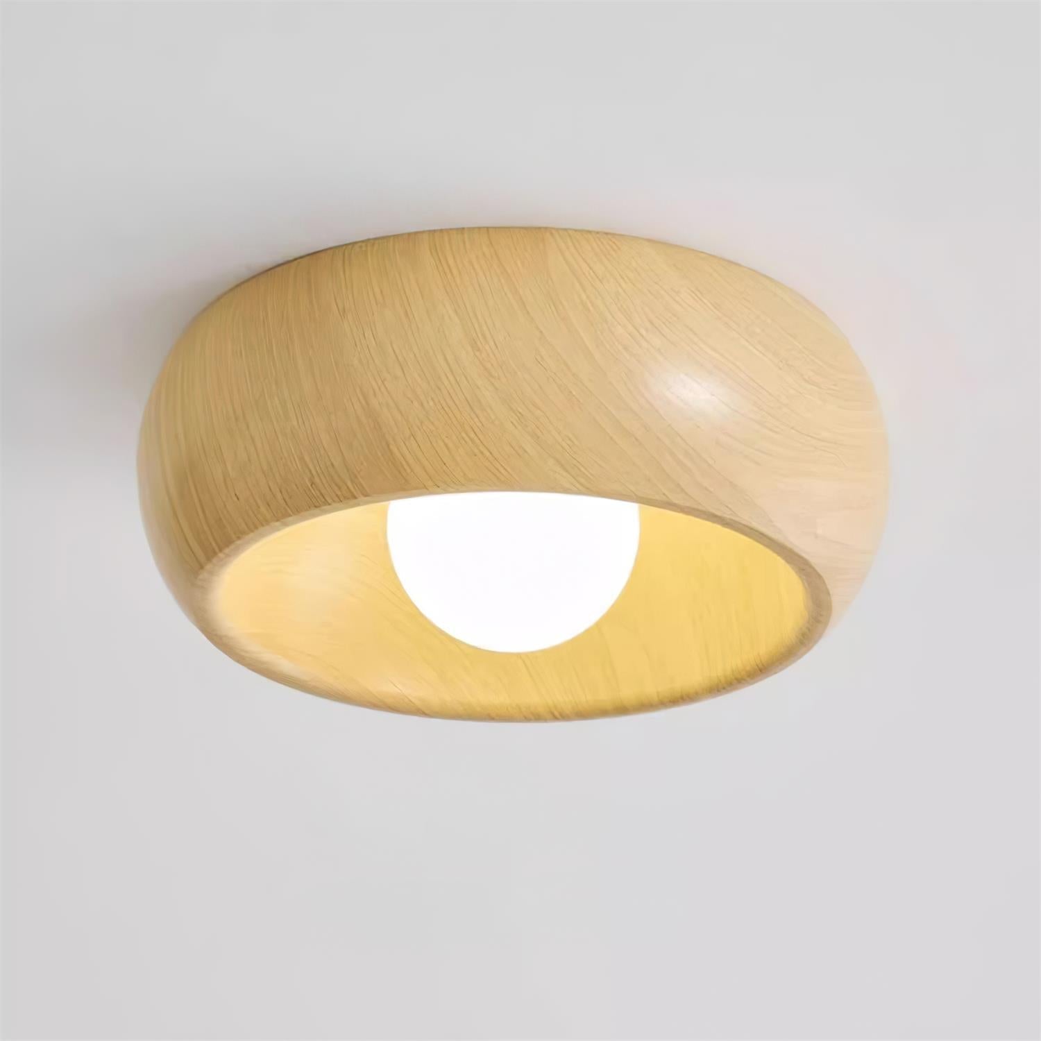 Wooden ceiling light fixture on a plain background