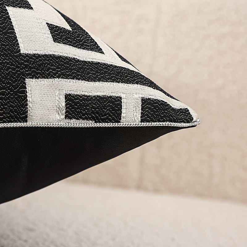 Black and white patterned pillow on a beige background