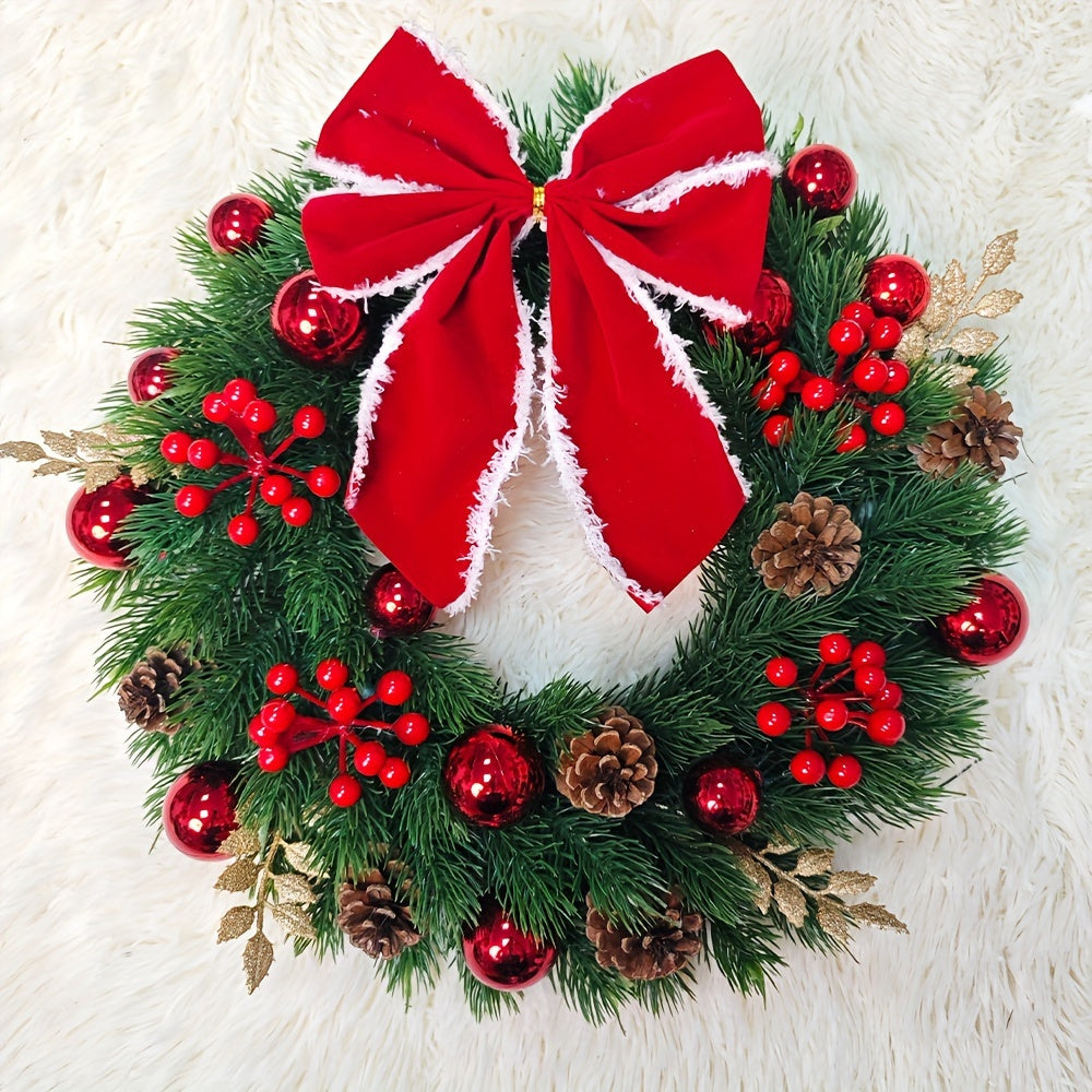 Christmas wreath with red berries, pine cones, and a large red bow on a white background