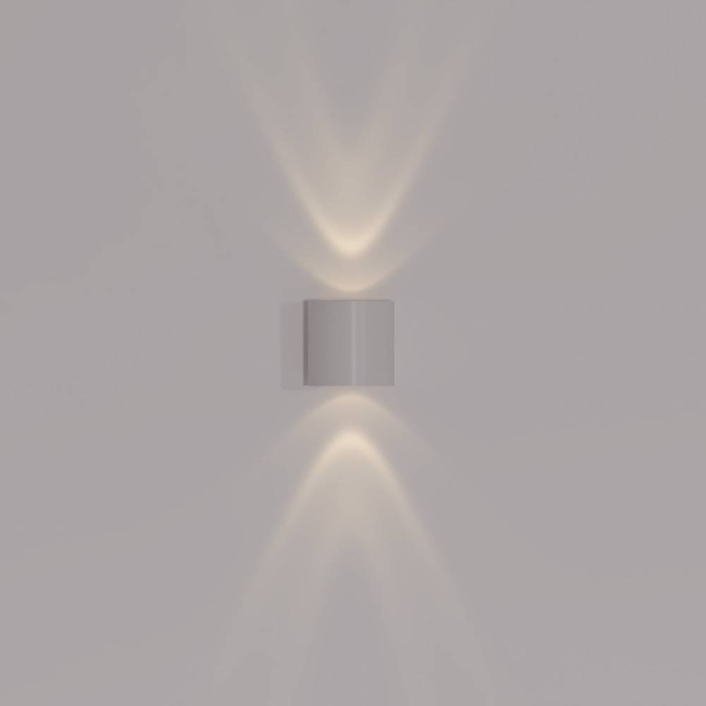 Modern wall-mounted light fixture on a plain wall