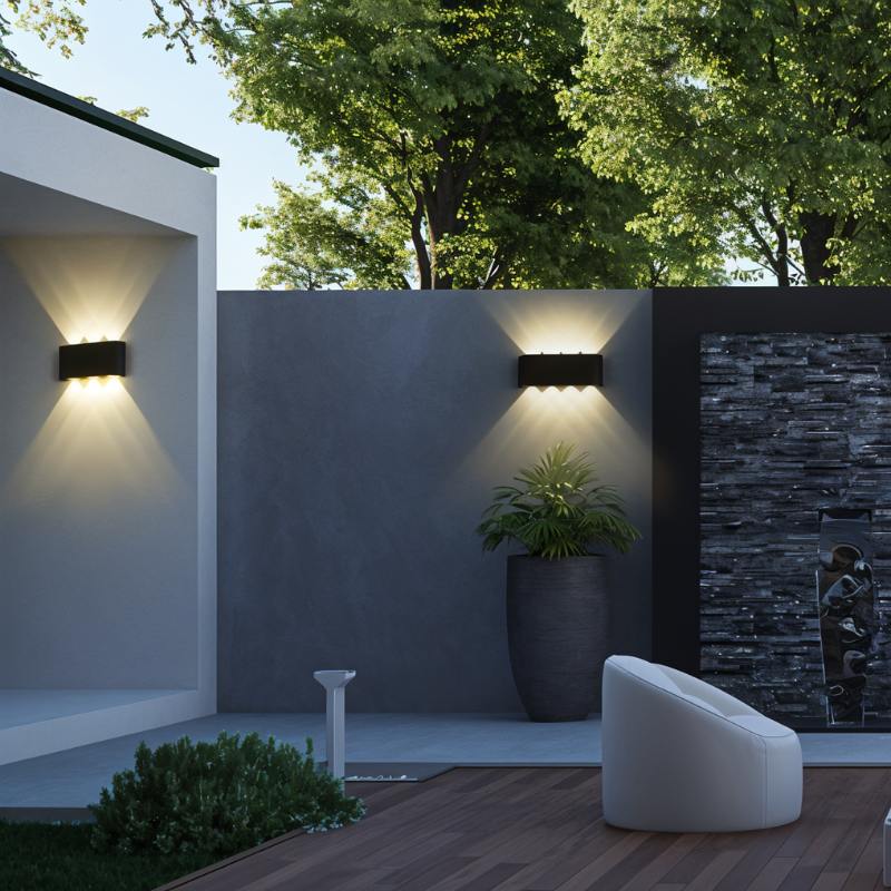 Modern outdoor setting with wall lights, a plant, and a bench.